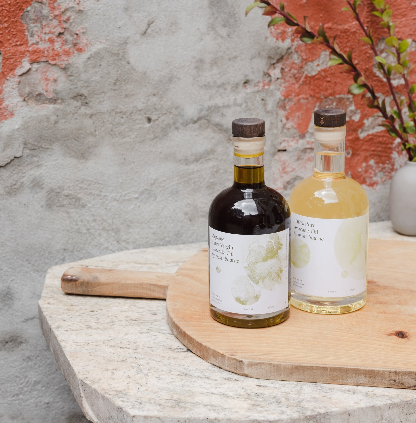 Two bottles of avocado oil placed on a table